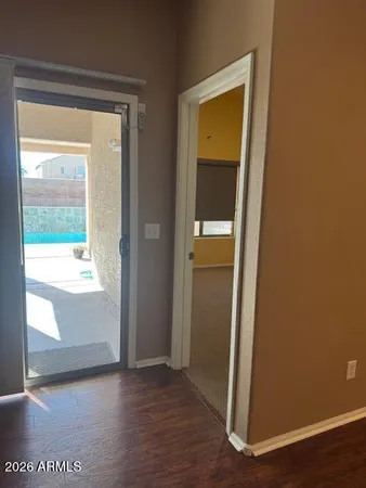 an empty room with wooden floor