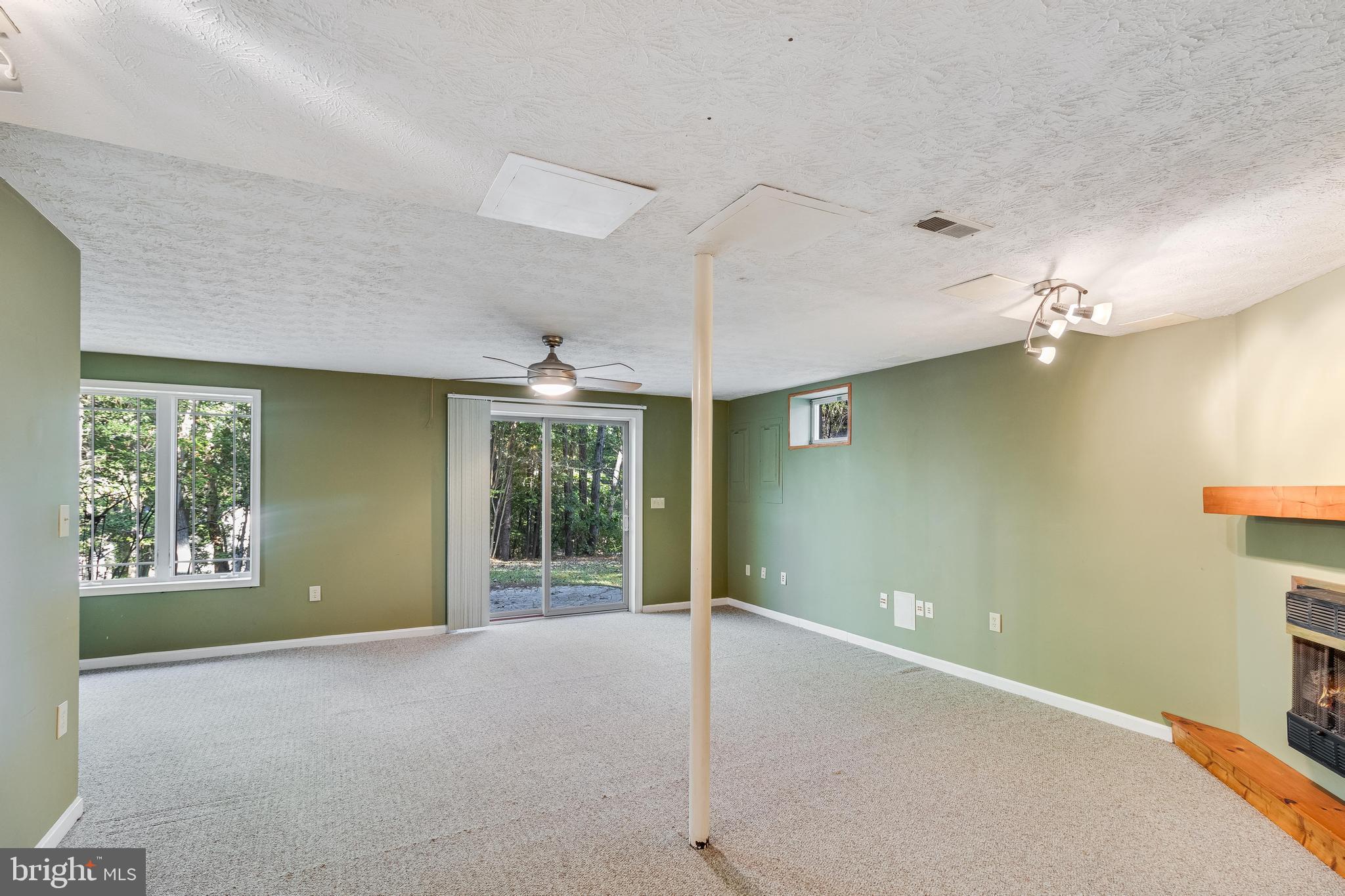 12954 Soundings Road Lusby, MD 20657 - Photo 27 of 51 Lover Level Entertainment Area