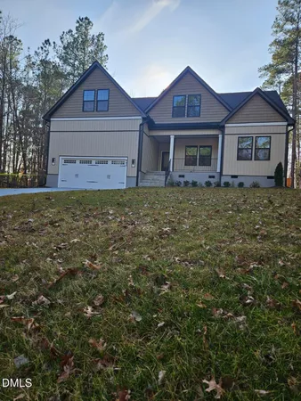 a front view of a house with yard