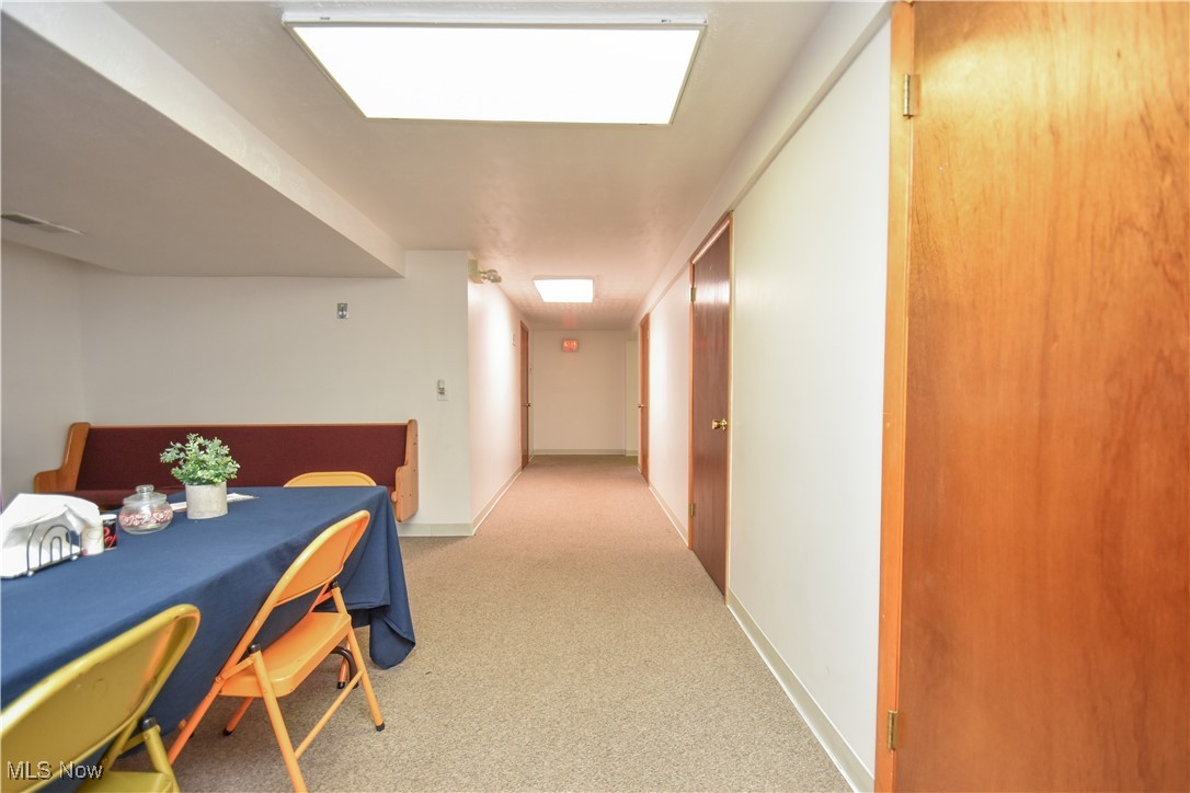 1187 Deforest Road Southeast Warren, OH 44484 - Photo 32 of 42 Corridor featuring carpet and baseboards