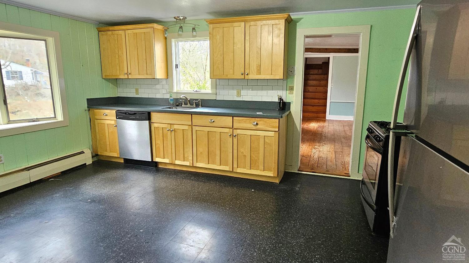 51 Dunbar Road Hudson, NY 12534 - Photo 5 of 32 a kitchen with stainless steel appliances granite countertop a refrigerator a sink and a stove