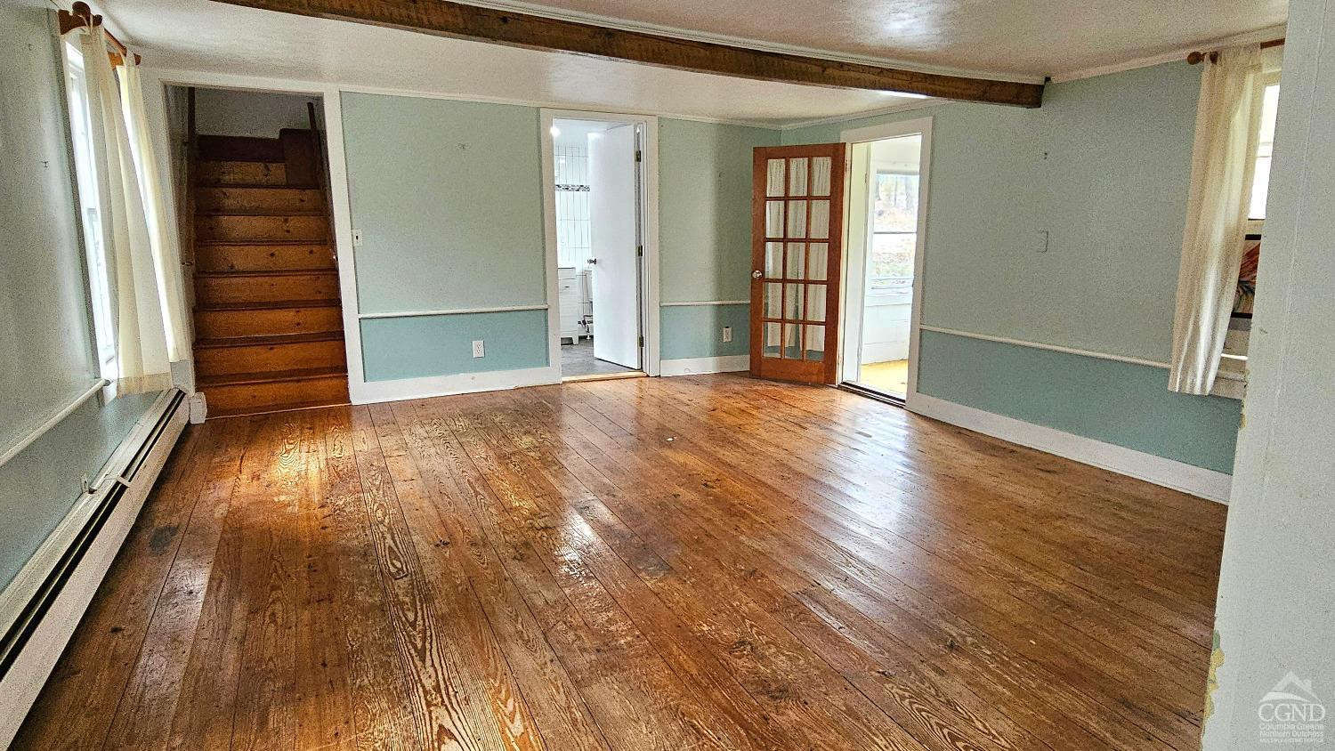 51 Dunbar Road Hudson, NY 12534 - Photo 6 of 32 an empty room with wooden floor and windows