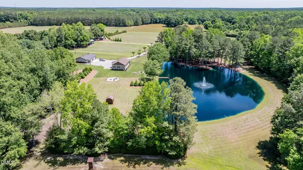 a view of a swimming pool with a yard