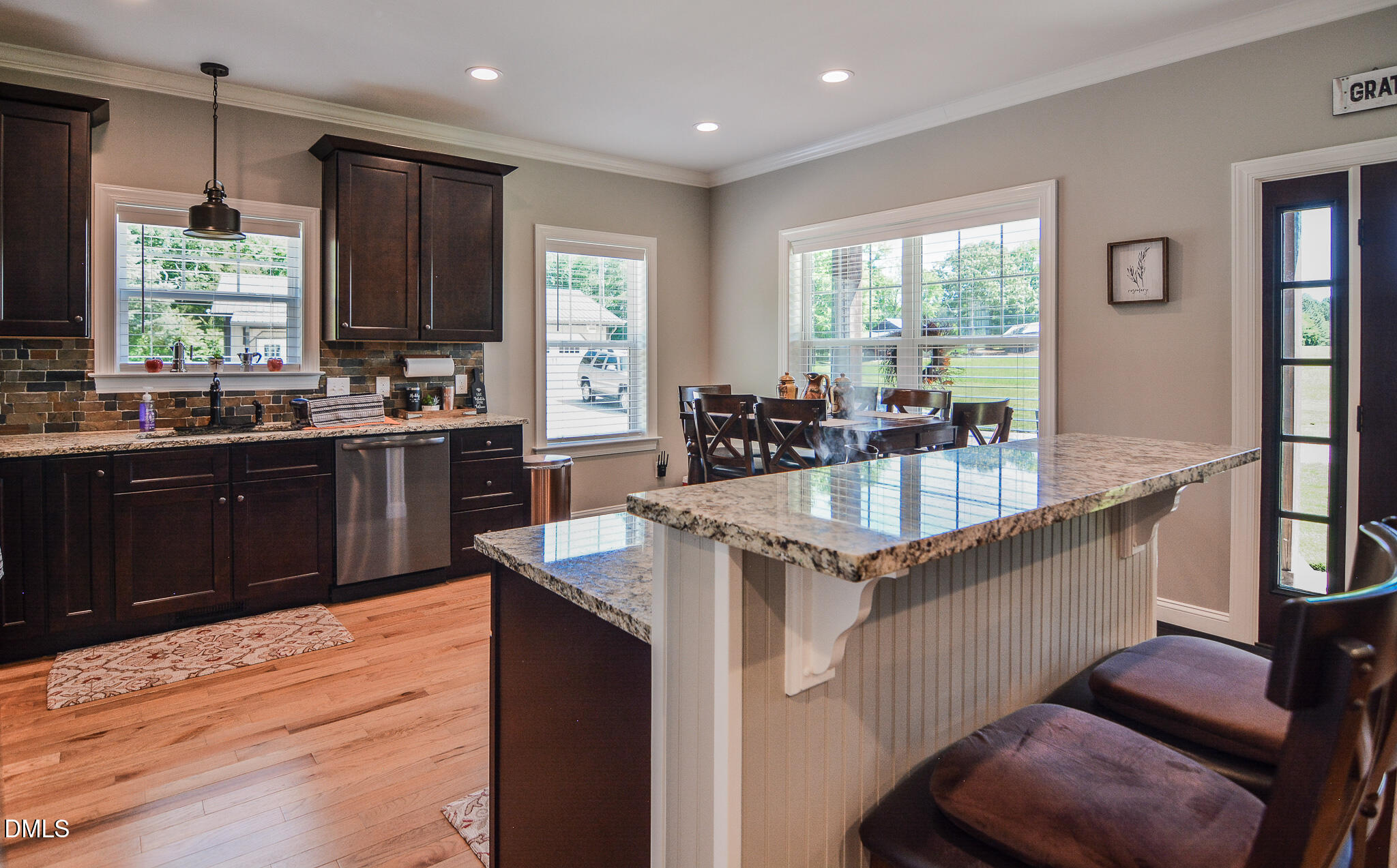 394 King Road Castalia, NC 27816 - Photo 19 of 100 a kitchen with granite countertop a sink counter top space and living room view