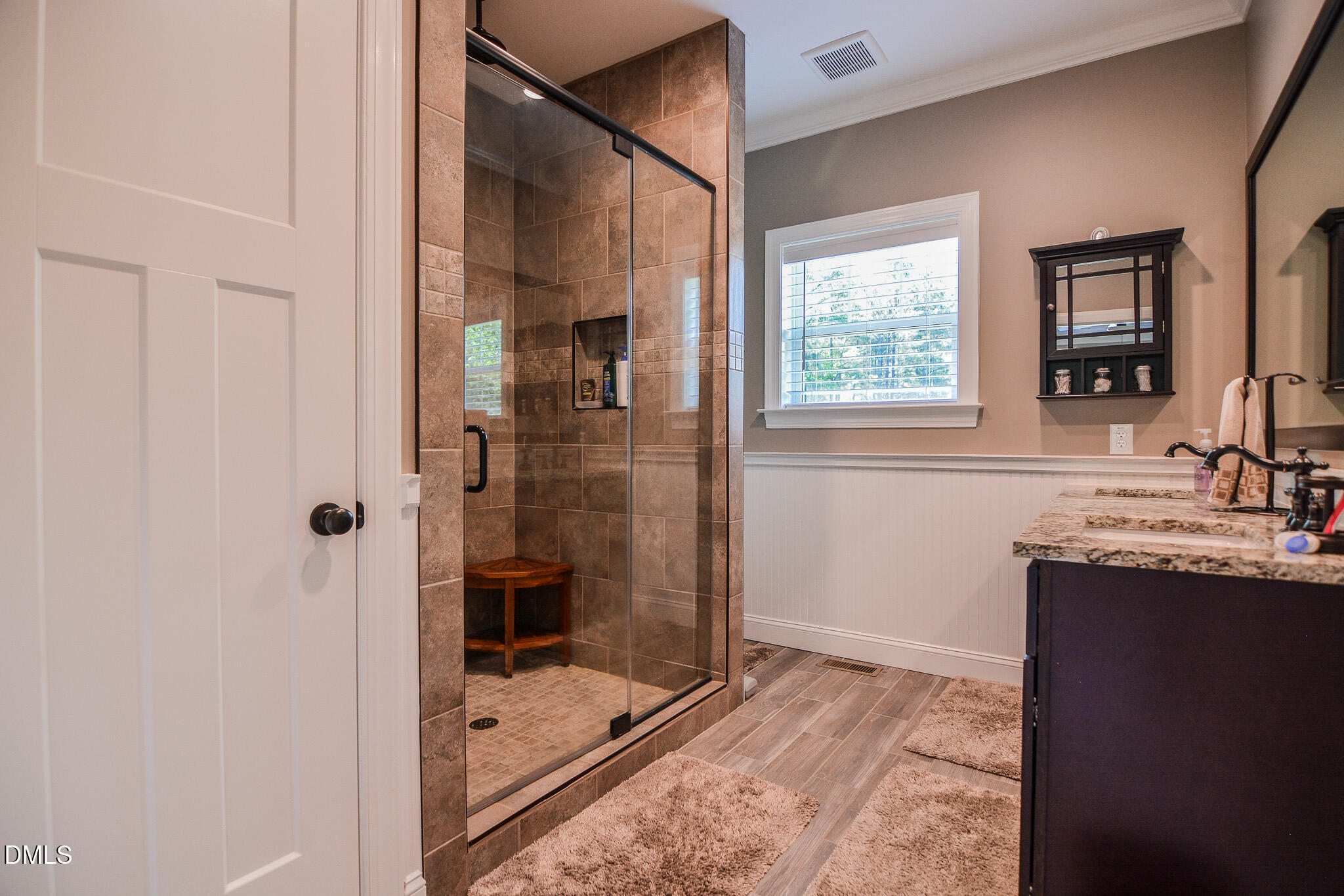 394 King Road Castalia, NC 27816 - Photo 25 of 100 a bathroom with a granite countertop sink a mirror and shower
