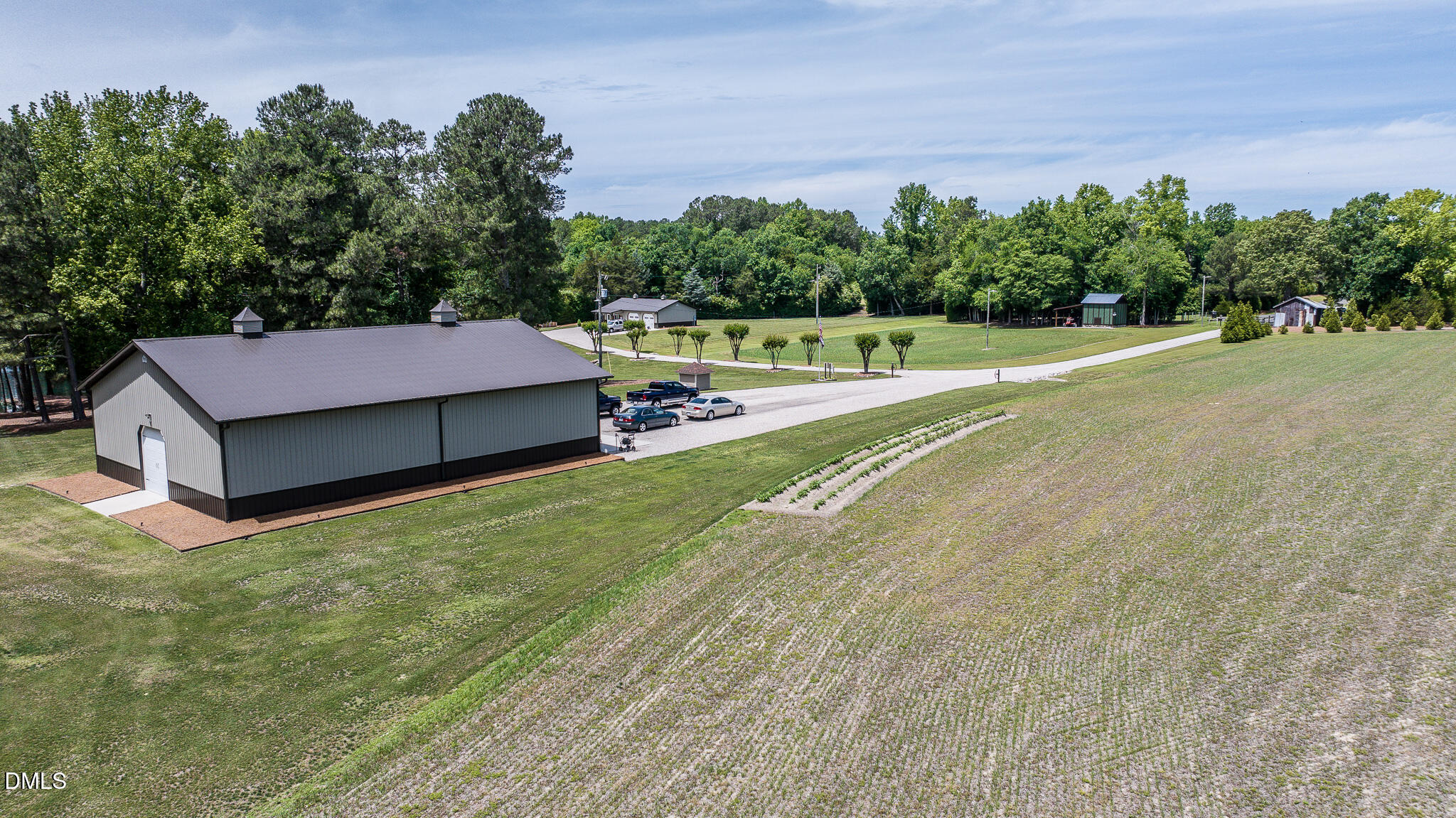 394 King Road Castalia, NC 27816 - Photo 38 of 100 a view of a big yard with potted plants and large tree