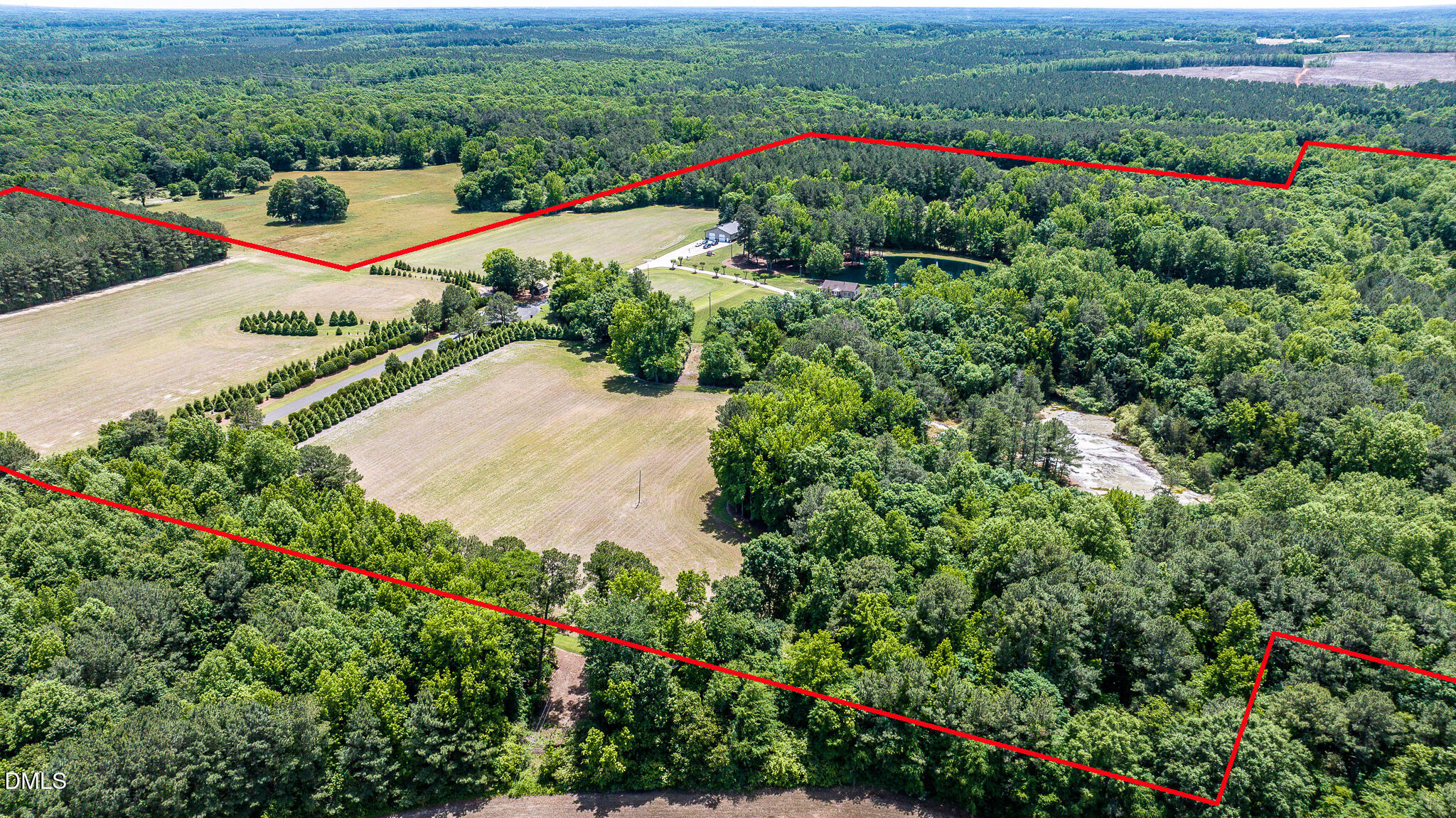 394 King Road Castalia, NC 27816 - Photo 59 of 100 a view of a garden with a lot of flower plants and wooden fence