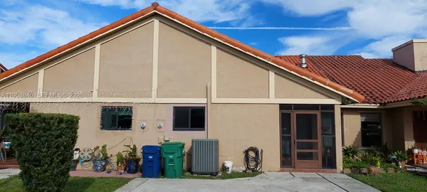 a view of house with yard