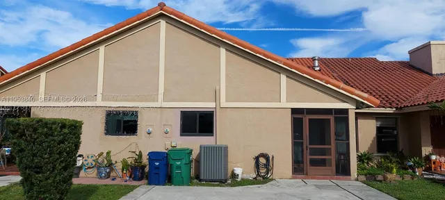 a view of house with yard
