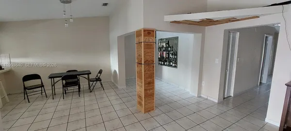 a kitchen with granite countertop a sink and a stove