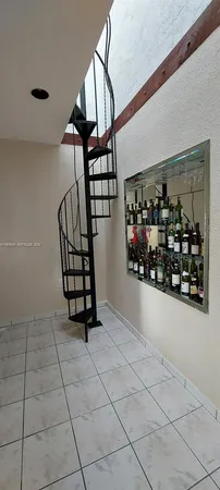 a view of an empty room and a window