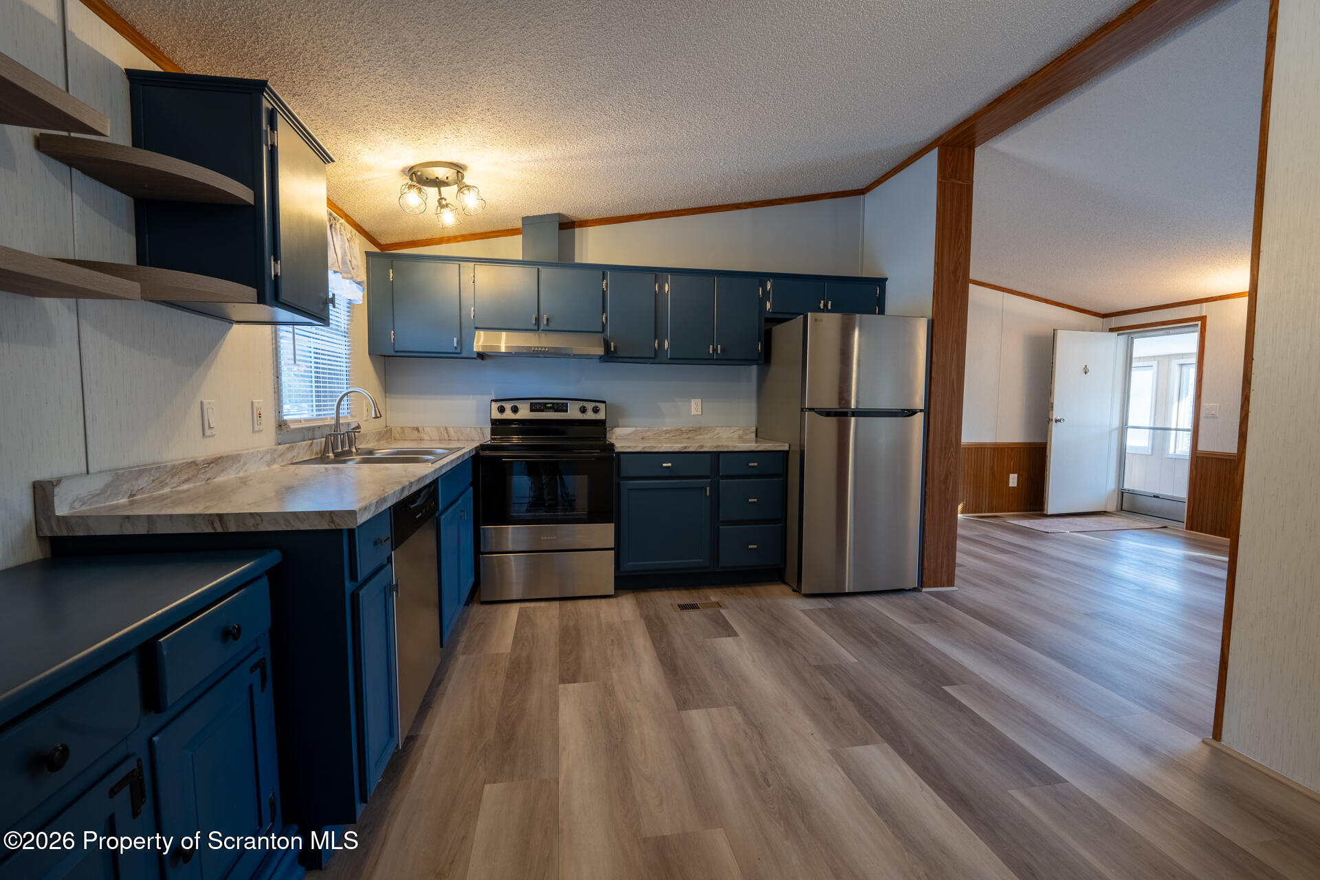 13 Hillside Drive Nicholson, PA 18446 - Photo 16 of 34 a kitchen with stainless steel appliances a refrigerator and a stove top oven