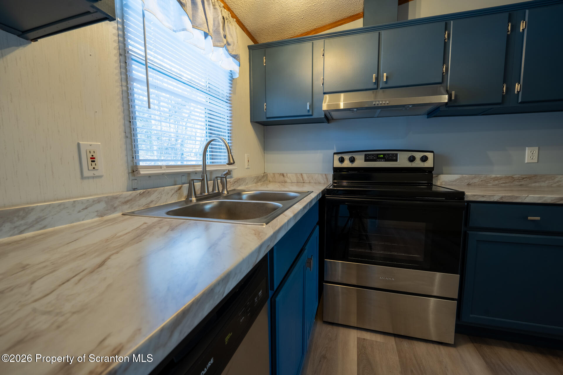13 Hillside Drive Nicholson, PA 18446 - Photo 17 of 34 a kitchen with a sink and a stove