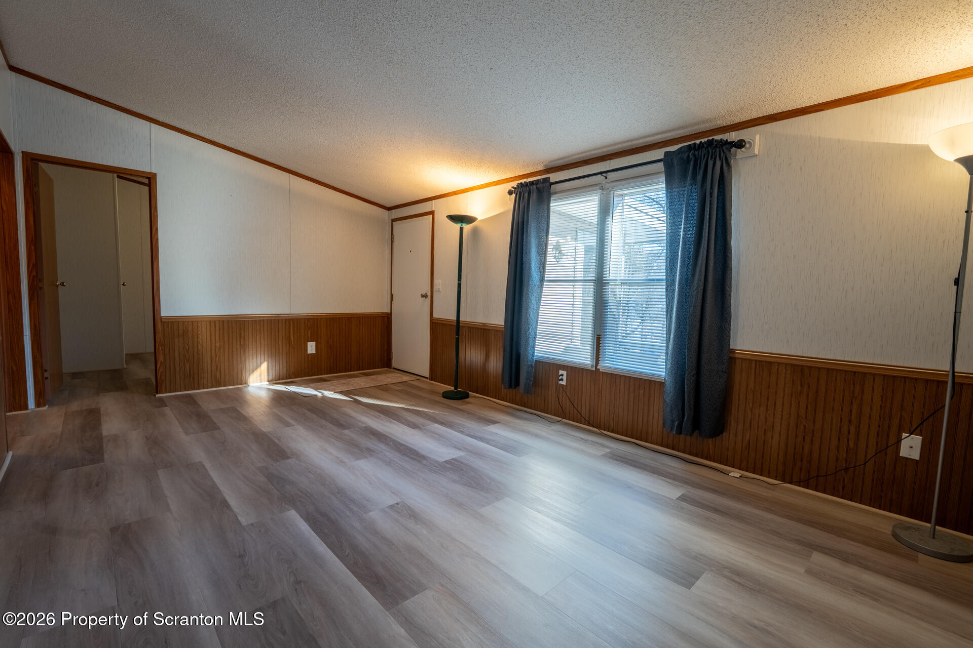13 Hillside Drive Nicholson, PA 18446 - Photo 21 of 34 a view of an empty room with wooden floor and a window