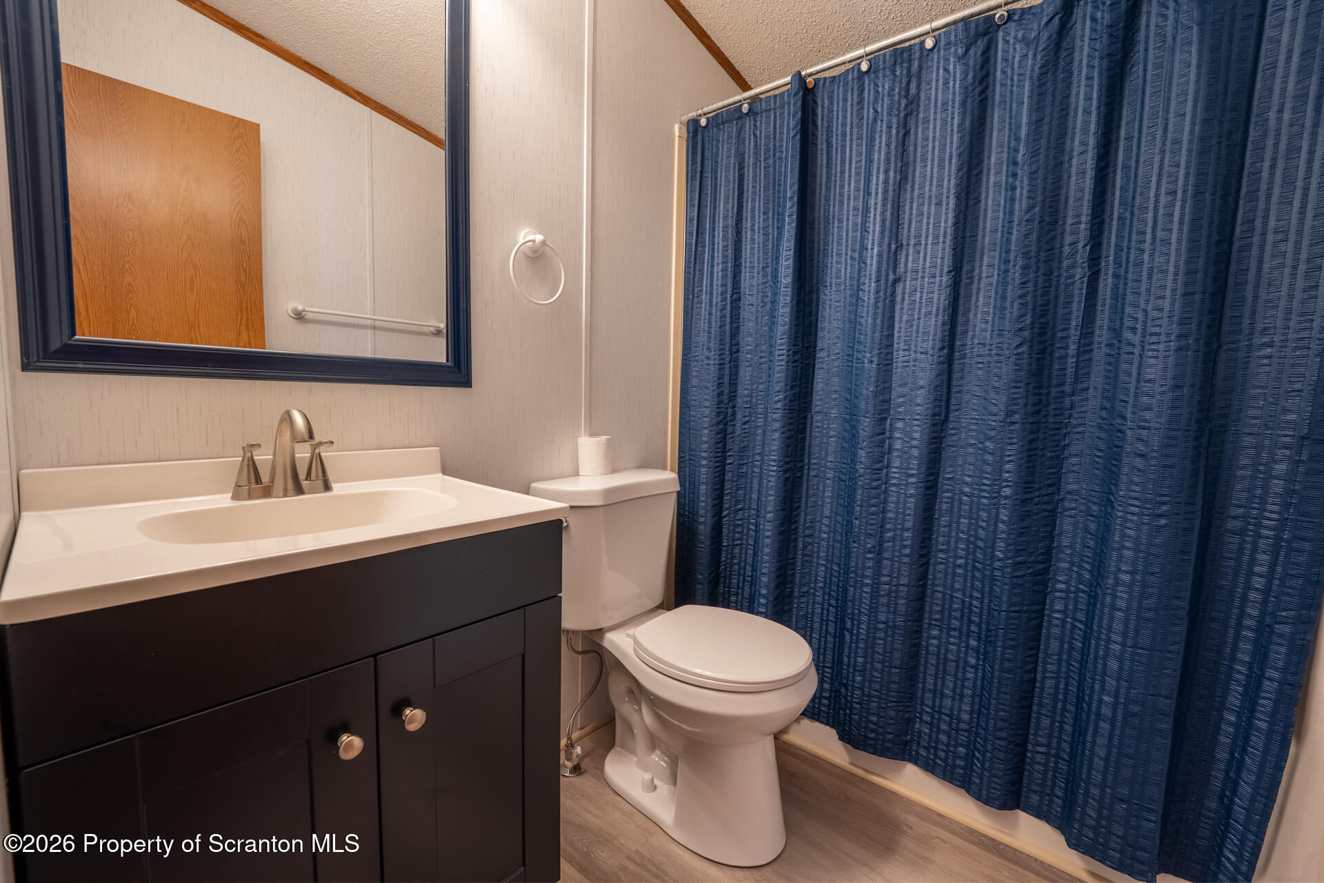 13 Hillside Drive Nicholson, PA 18446 - Photo 25 of 34 a bathroom with a sink vanity mirror and toilet
