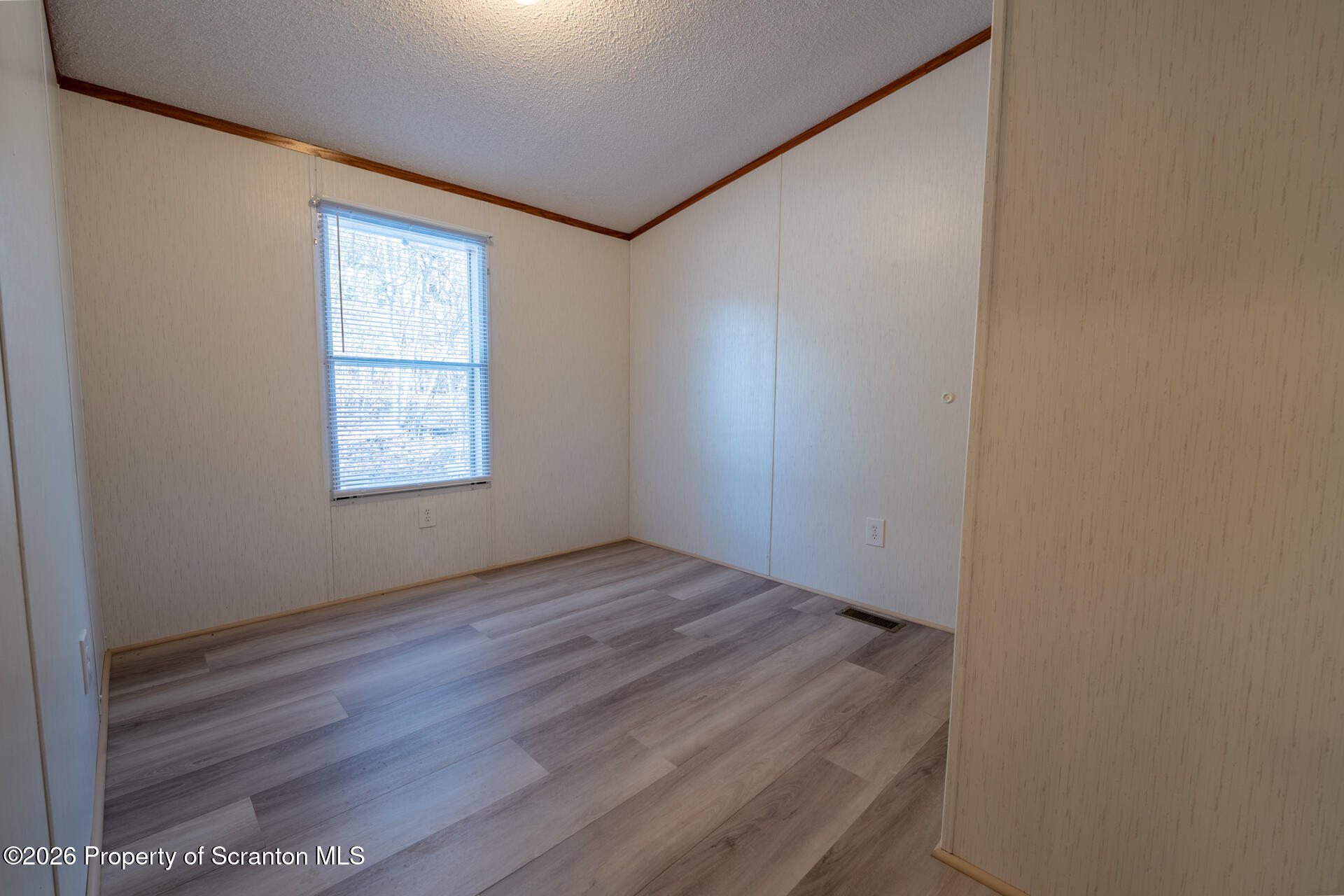 13 Hillside Drive Nicholson, PA 18446 - Photo 26 of 34 an empty room with wooden floor and windows