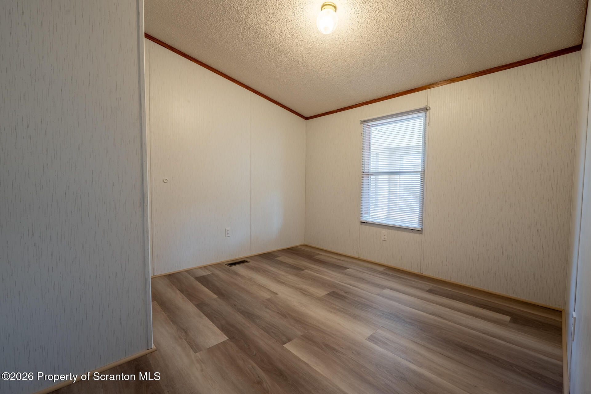 13 Hillside Drive Nicholson, PA 18446 - Photo 27 of 34 a room with a bed and a window