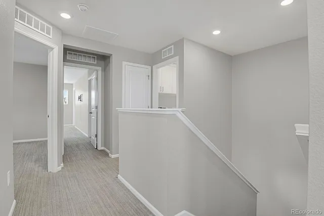 a spacious bedroom with a large bed and a window