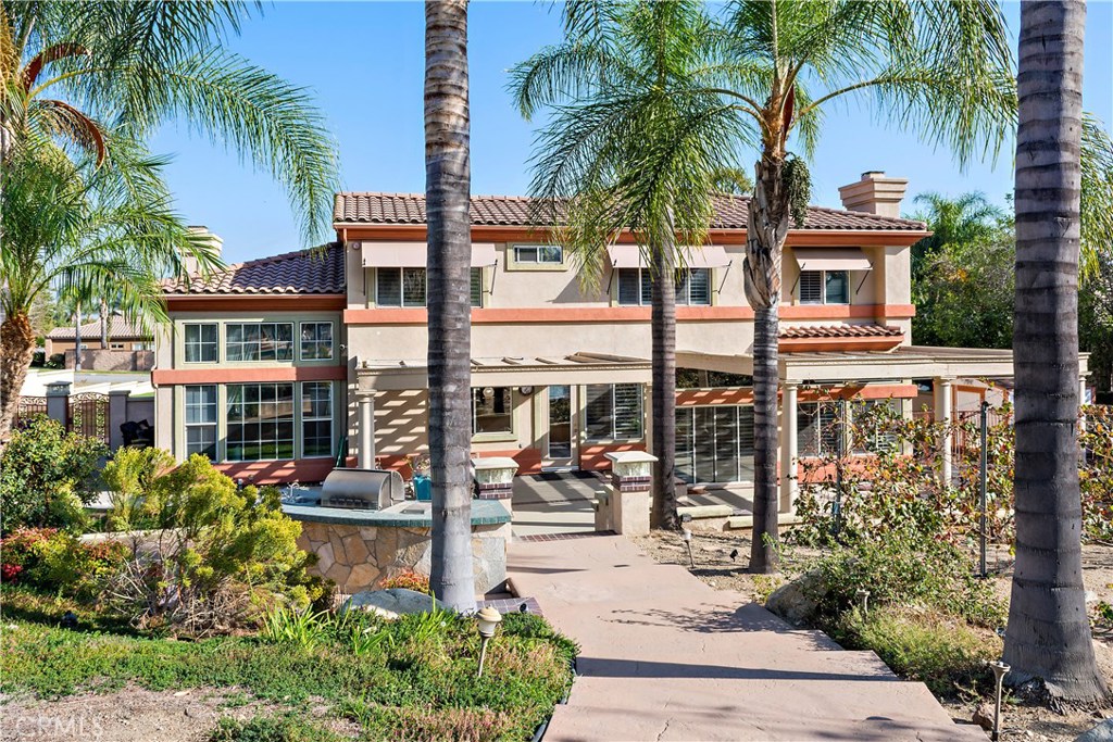 4954 Crestview Place Rancho Cucamonga, CA 91701 - Photo 11 of 40 a front view of multiple houses with yard
