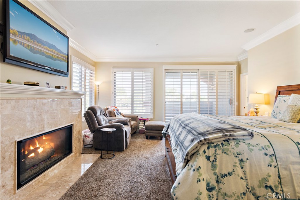4954 Crestview Place Rancho Cucamonga, CA 91701 - Photo 29 of 40 a bedroom with a bed and a flat screen tv