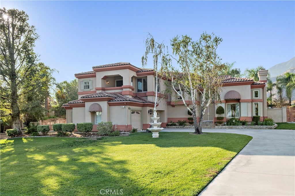 4954 Crestview Place Rancho Cucamonga, CA 91701 - Photo 3 of 40 a front view of a house with a yard