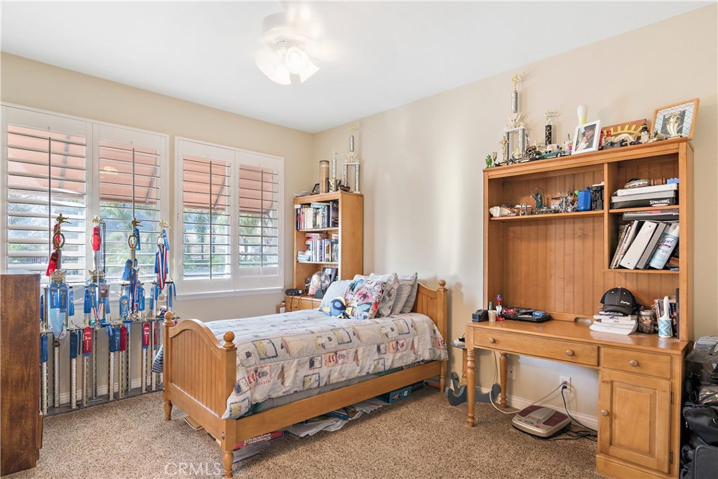 4954 Crestview Place Rancho Cucamonga, CA 91701 - Photo 34 of 40 a bedroom with a bed and a window