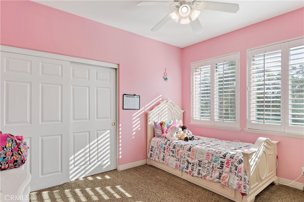 4954 Crestview Place Rancho Cucamonga, CA 91701 - Photo 36 of 40 a bed room with a bed and a window