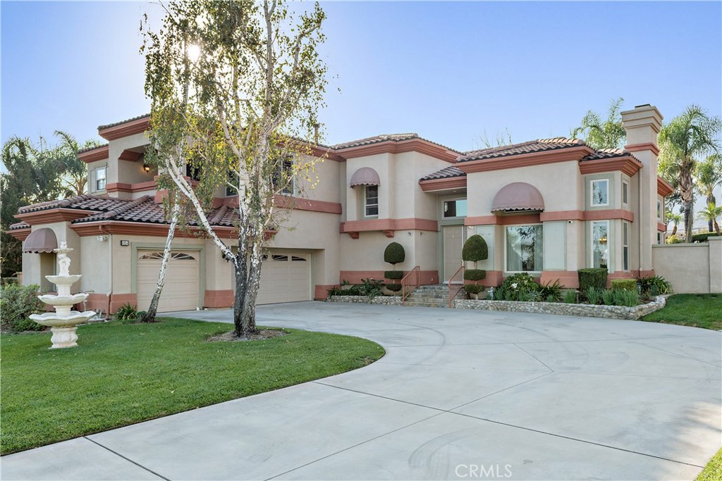 4954 Crestview Place Rancho Cucamonga, CA 91701 - Photo 4 of 40 a front view of house with yard and green space