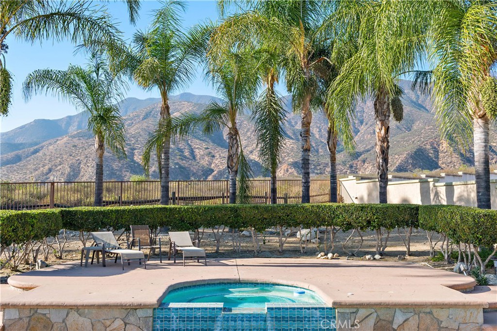 4954 Crestview Place Rancho Cucamonga, CA 91701 - Photo 7 of 40 a swimming pool with outdoor seating and yard