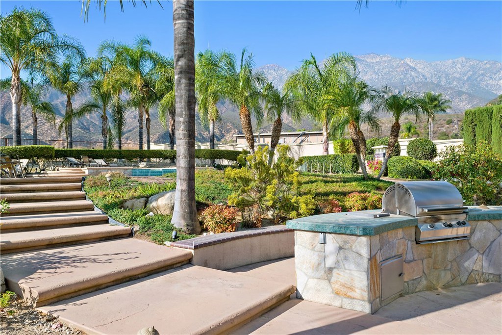 4954 Crestview Place Rancho Cucamonga, CA 91701 - Photo 8 of 40 a view of a yard with palm trees