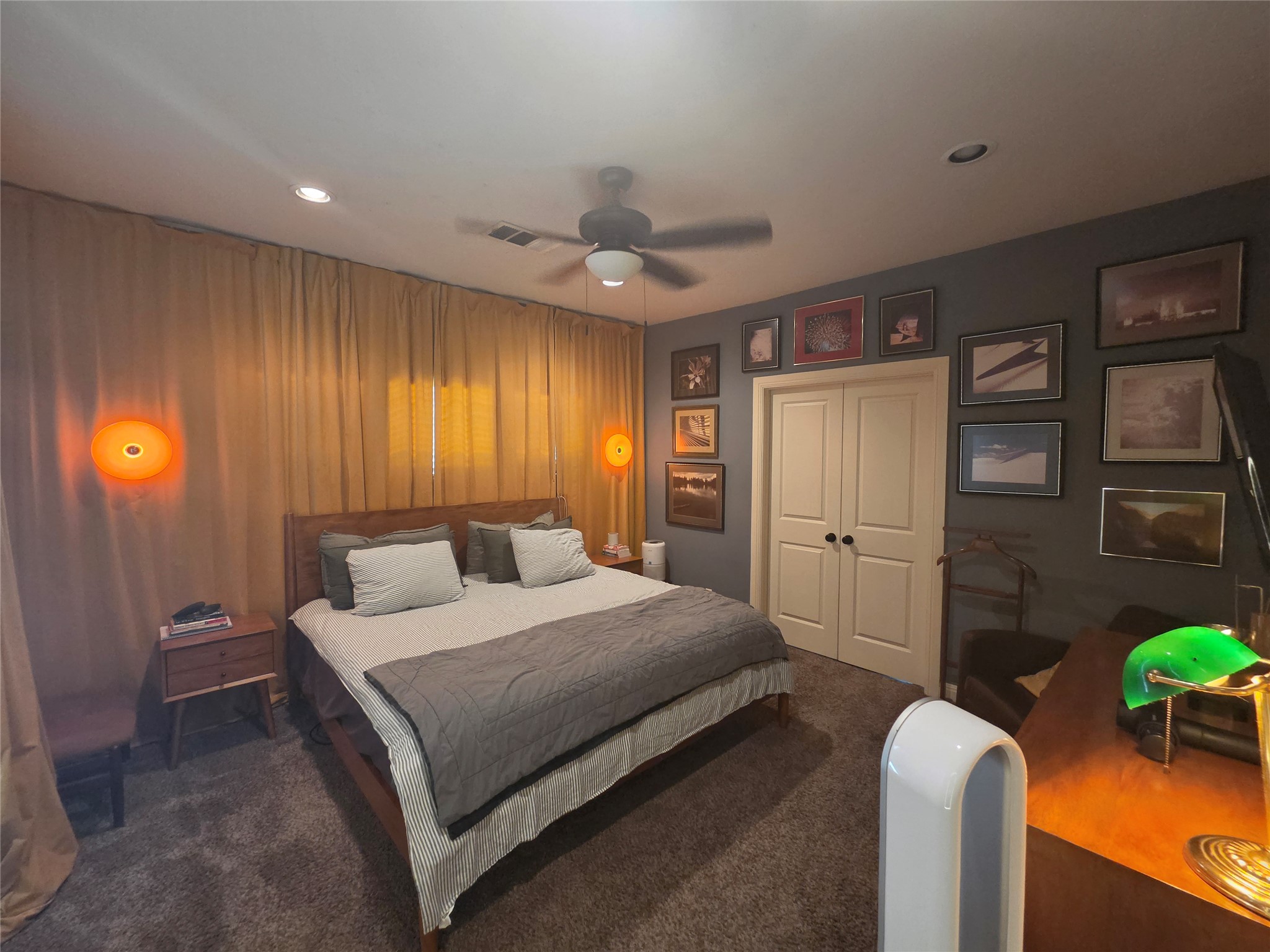 408 West Croslin Street Austin, TX 78752 - Photo 7 of 29 A comfortable bedroom with rich dark walls, bright lighting and ample closet space.