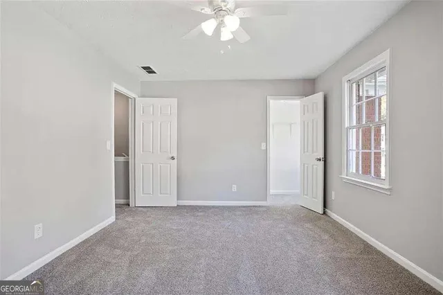 a view of an empty room with a window