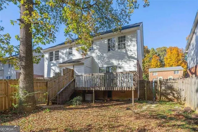 a house with a tree in front of it