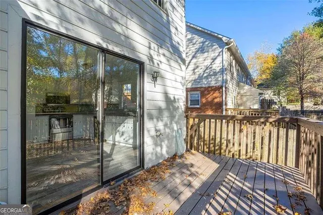 a view of a balcony with wooden floor