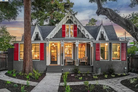 a front view of houses with yard