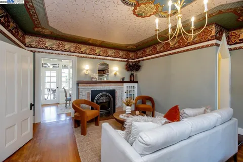 a bedroom with bed and a large window