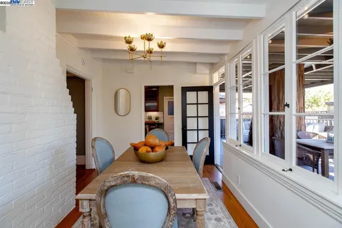 a dining room with a table and chairs