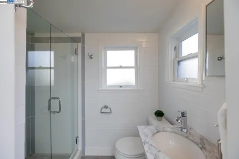 a bedroom with bed and window