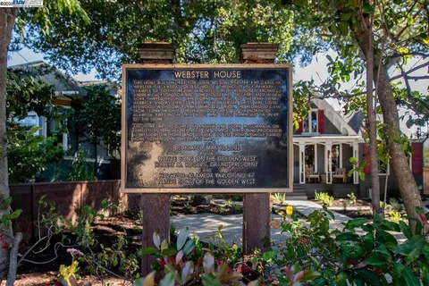 a view of balcony with two chairs and a fire pit