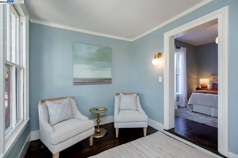 a bedroom with bed and a window