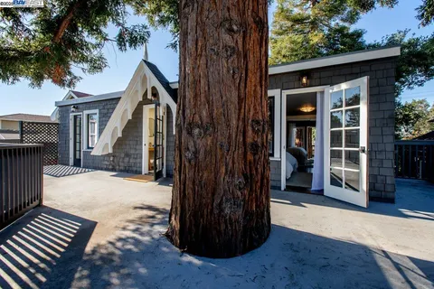 a living room with a window and furniture