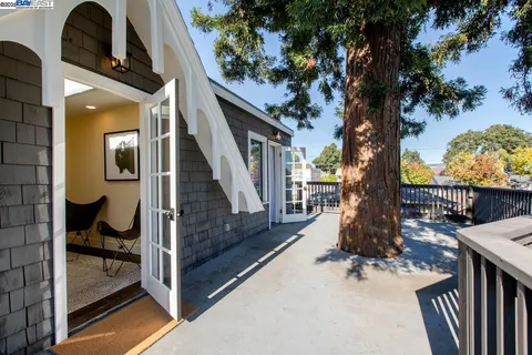 a outdoor living space with furniture floor to ceiling window and wooden floor