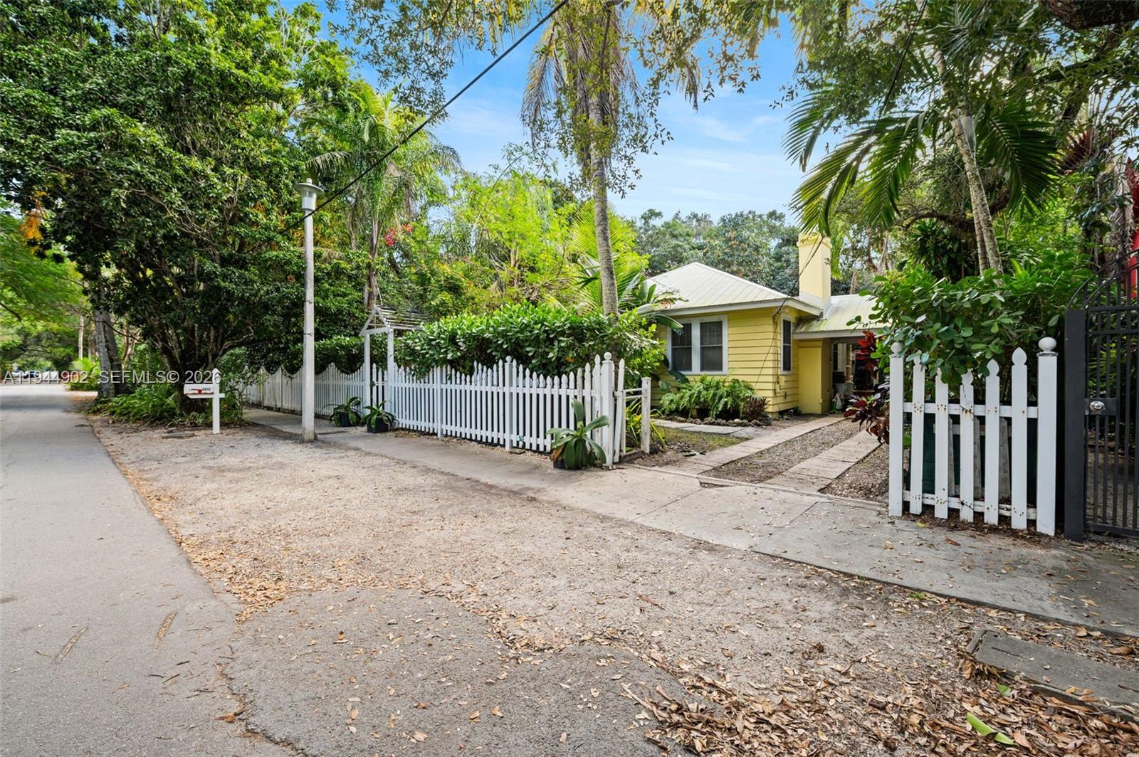 3972 Loquat Avenue Miami, FL 33133 - Photo 6 of 9 a view of a house with a yard and sitting area