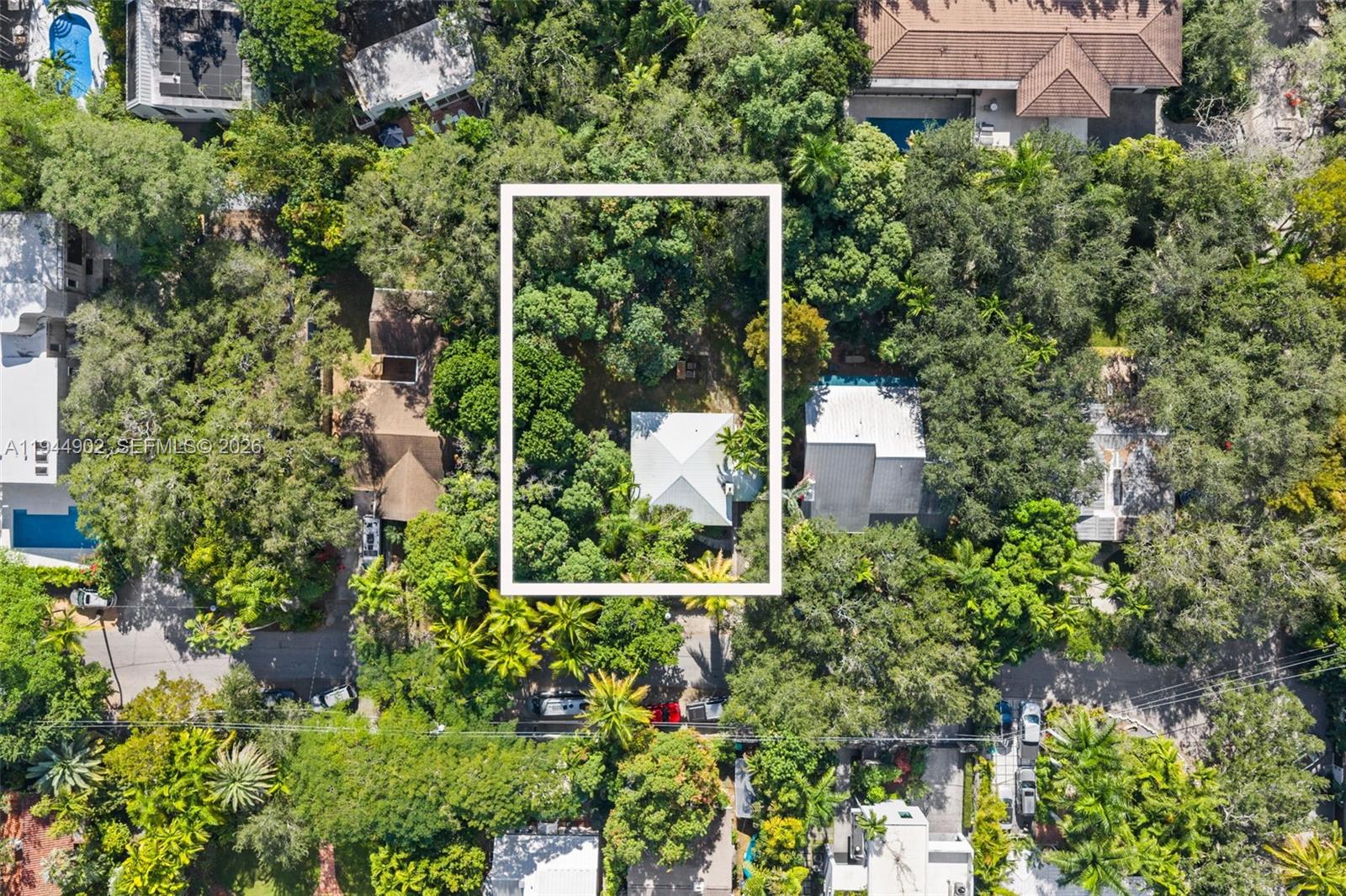 3972 Loquat Avenue Miami, FL 33133 - Photo 8 of 9 an aerial view of a house with a yard and garden