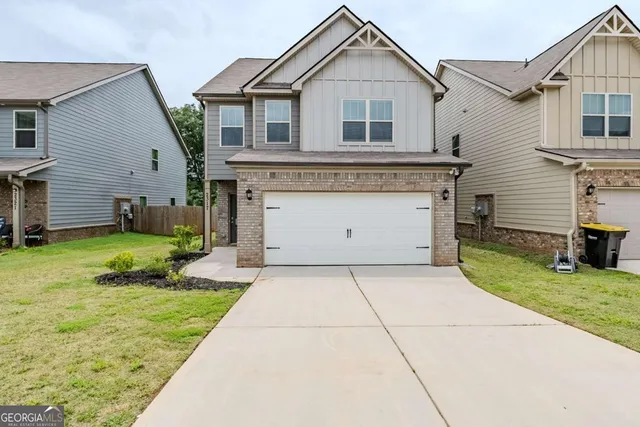 a front view of a house with yard