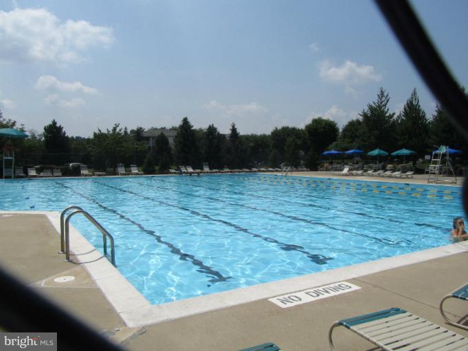 107 Bishopstone Circle Frederick, MD 21702 - Photo 19 of 21 a view of a swimming pool with a yard