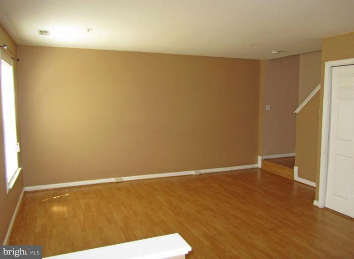 107 Bishopstone Circle Frederick, MD 21702 - Photo 4 of 21 a view of an empty room with wooden floor