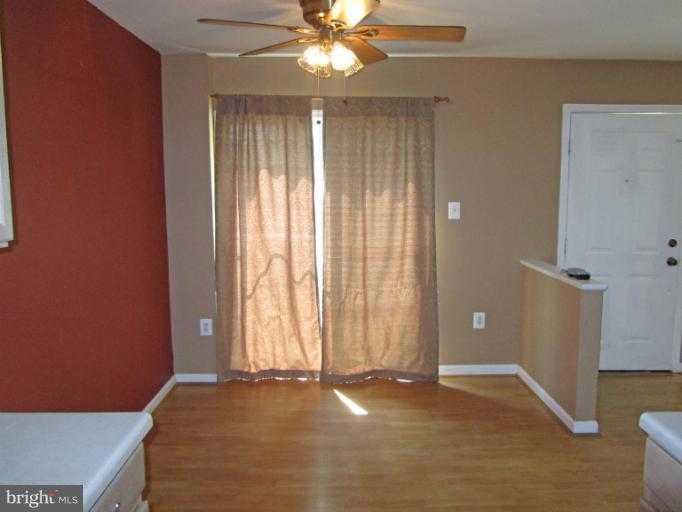 107 Bishopstone Circle Frederick, MD 21702 - Photo 7 of 21 an empty room with windows and fan
