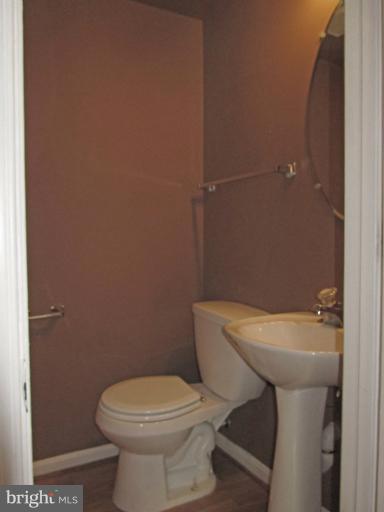 107 Bishopstone Circle Frederick, MD 21702 - Photo 8 of 21 a white toilet sitting next to a white sink