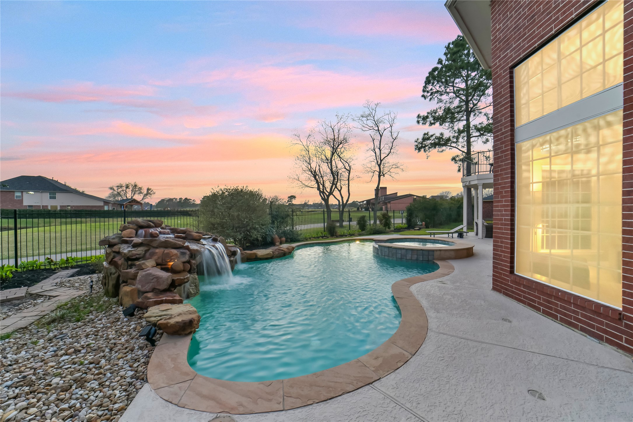 24403 Falcon Point Drive Katy, TX 77494 - Photo 29 of 32 Enjoy serene views of the golf course from the edge of your private, resort-style pool.